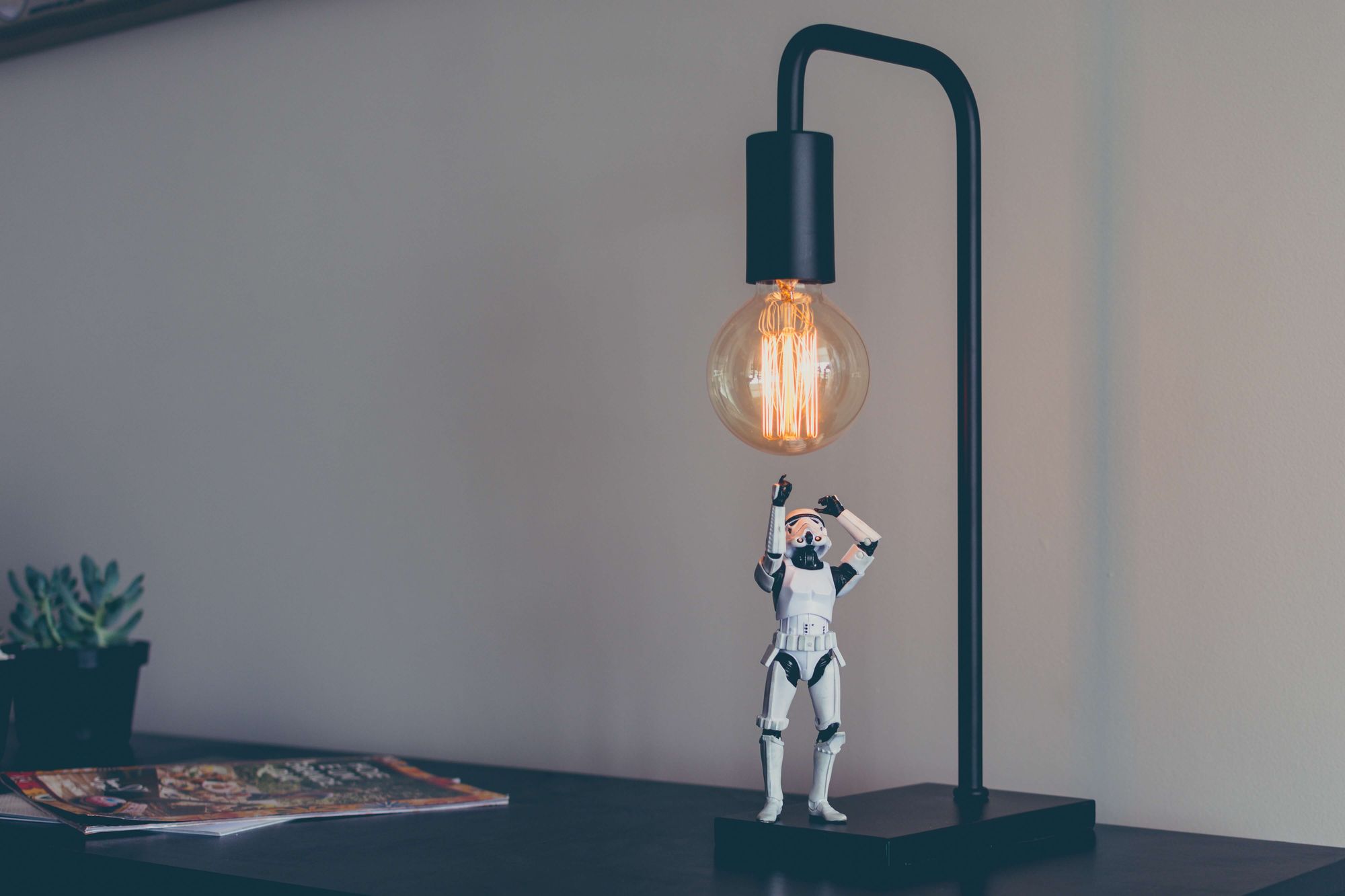 Stormtrooper trying to touch a light bulb